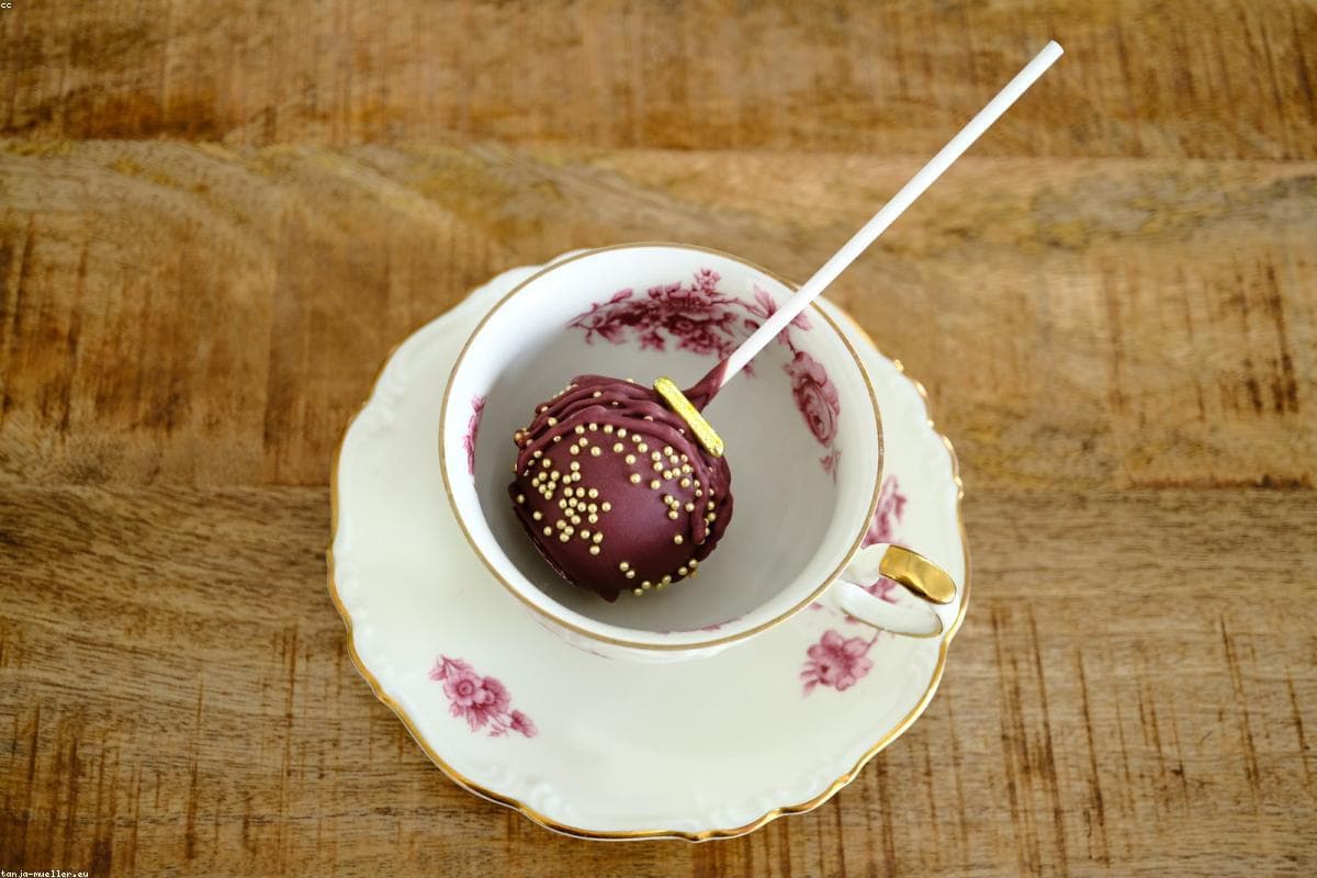 Hand-dipped cake pops arranged on a dessert stand